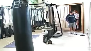 Full of energy, a growing teenager undergoes a tough training in the gym