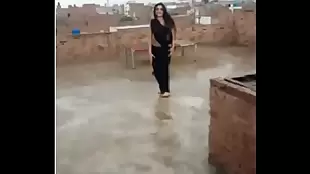 sexy outdoor dance of an Indian teenager who has reached adulthood in a sari of indeterminate age